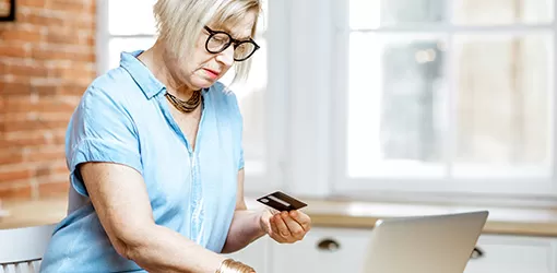 woman in covington, va shopping online using credit card