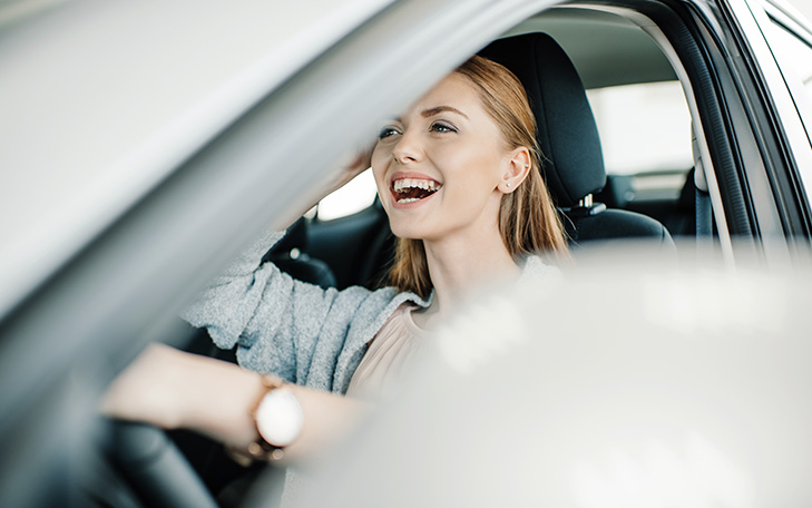 Woman driving used car in Covington, Virginia with Jackson River Community Credit Union loan